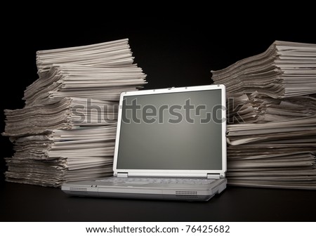 Newspaper and Laptop