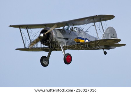 England UK circa 2014 An unnamed pilot flies the Gloster Gladiator BiPlane at a vintage air pageant
