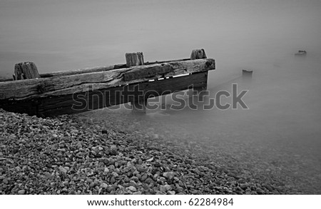 A black and white water break on a shingle beach
