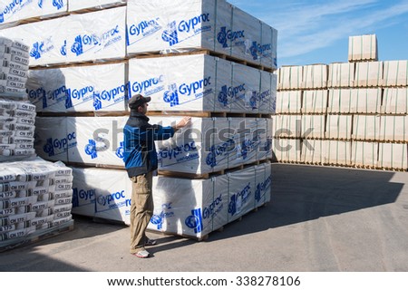 St. Petersburg, Russia-July 16, 2015: Warehouses building network of hypermarkets,  supervisor is  working in warehouses.