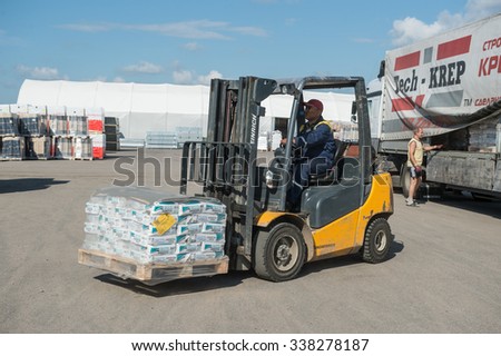 St. Petersburg, Russia-July 16, 2015: Warehouses building network of hypermarkets,  supervisors and drivers  are working in warehouses.