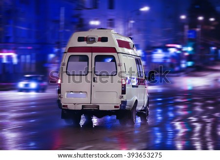 ambulance goes on the night rainy city