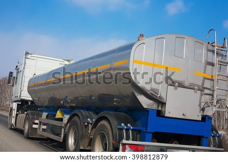 fuel truck with the chromeplated tank goes on the highway