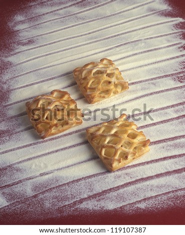 advertising photography with bakery products, sweet grid cake pieces isolated on flour background with hand drawn lines