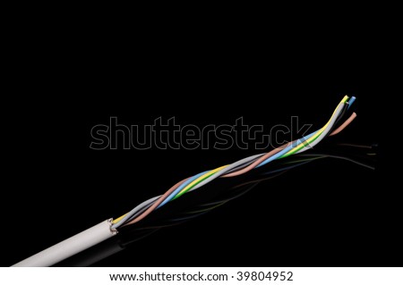 Macro detail of a electrical cable wires used in domestic and commercial installations. On black background.