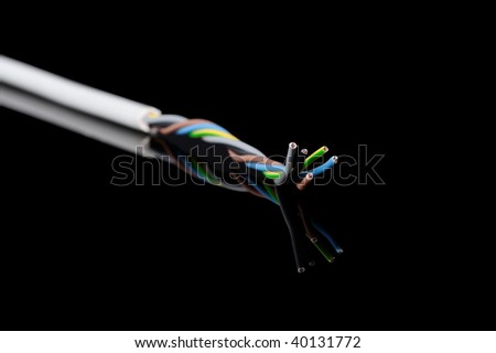 Macro detail of a electrical cable wires used in domestic and commercial installations. On black background.