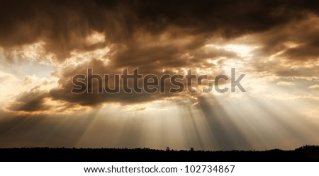 God\'s eye. Landscape cloudy sky, with rays of the sun.