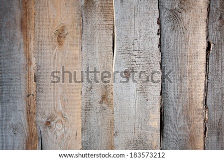 The wall arranged with the old, curved boards.