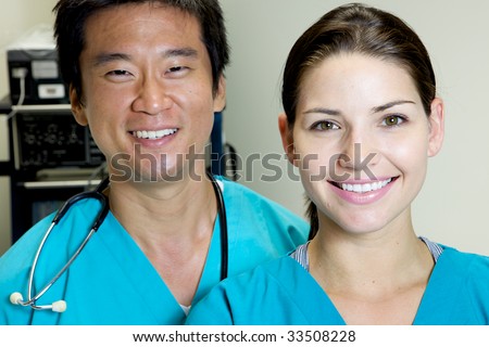 An asian and caucasian doctor team working