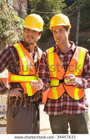 Two Construction Workers at the job working together