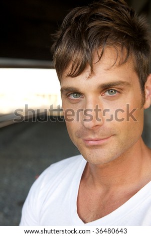 An Attractive Young Man with a Smirk at the Camera