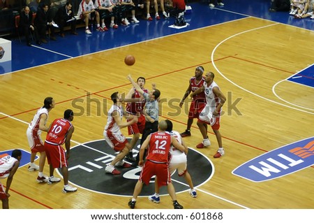 Tip off of basketball game in Milan, Italy. Breil Milano vs Scavolini Pesaro (01-25-2004)