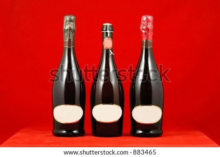 Three bottles of sparkling wine with blank label