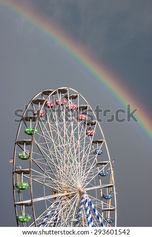 Ferris wheel and rainbow