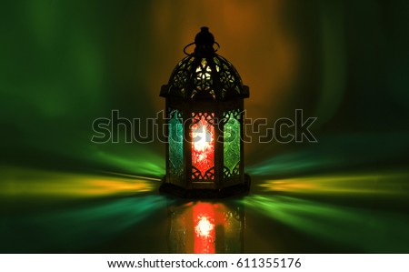 Light scattered from traditional arabic lantern.\
Ramadan background.