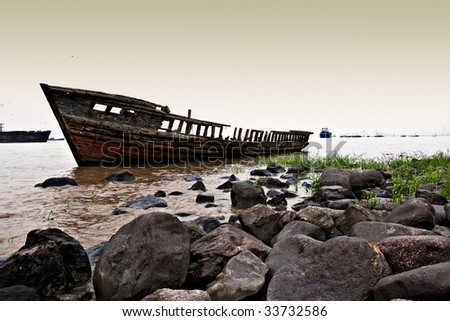 an old boat on Yangtze river in wusong  battery wetland forest park