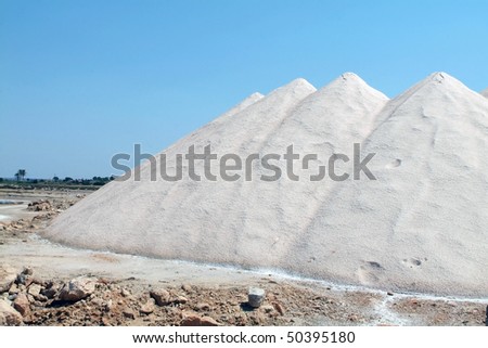 raw salt mine shot against blue sky in Mallorca, Spain