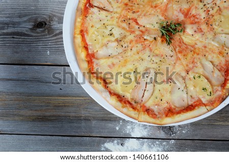 Sweet pizza with chicken and pineapples