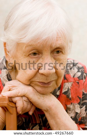 The sad old woman in a room