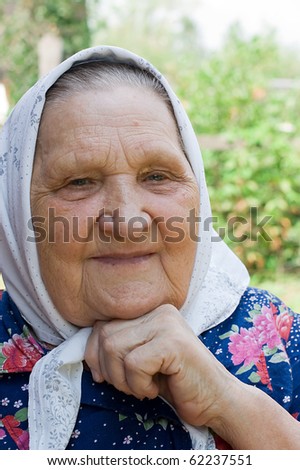 Portrait of the old woman in a scarf