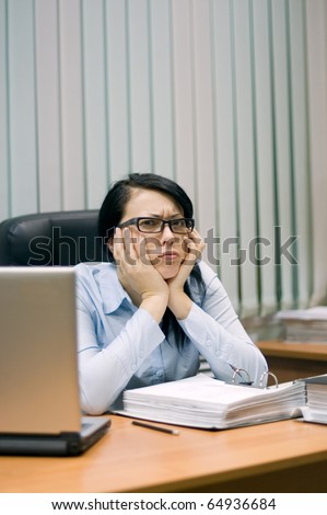 young girl at office behind a table