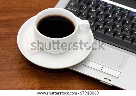 Cup from coffee on the laptop