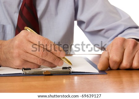 The businessman fills the document