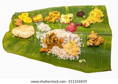 Onam Sadhya is Kerala vegetarian lunch served on a banana leaf on the occasion of festival Onam.Sambar,Rice,payasam,kichadi,pachadi,kalan,erishery,achaar