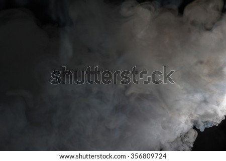 Smoke cloud over black background