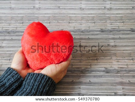 red heart in hand