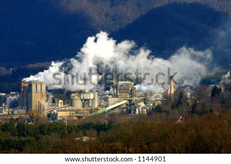 Industrial factory with steam and smoke