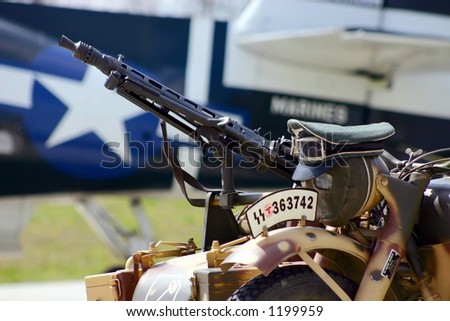 Motorcycle mounted machine gun with American star in background