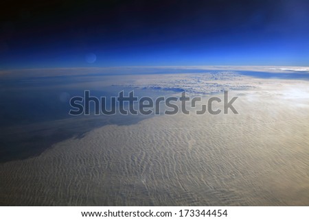 Planet surface with a celestial body, desolate landscape