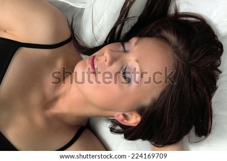 Woman in deep sleep in bed
