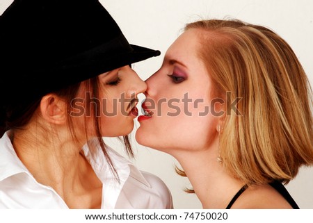 Androgynous couple kissing