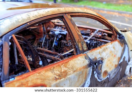 burned luxury car. the interior of of an expensive car damaged by arson