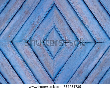 symmetrical background of the wooden planks on the wall. rhombus pattern of wooden planks painted lilac paint