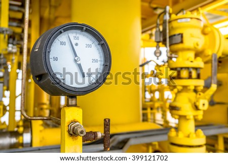 Pressure gauge for monitoring measure pressure in oil and gas process, Oil and gas offshore wellhead remote platform in the gulf or the sea, Energy and petroleum industry.