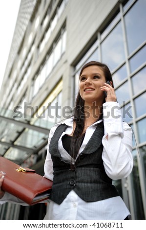 Woman. Leaving the work. In a shopping center. telephone conversation