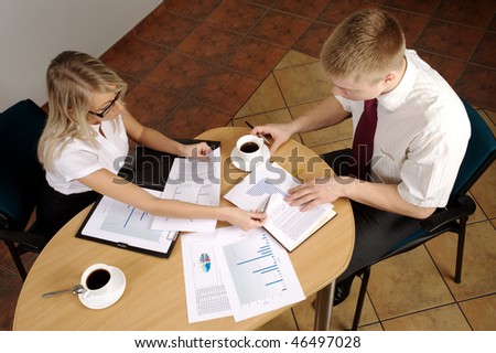 Office. Meeting On Business. Documents on the table. Business call. Team work to late hours.