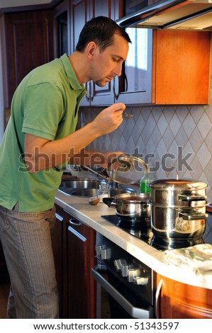 The guy in the kitchen. Young man cooking dinner for his family. Dad just like Mom.