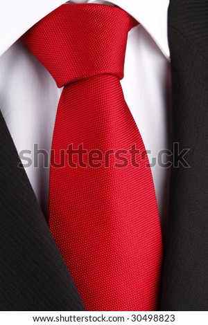 bright red tie on white shirt and black suit