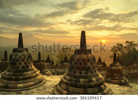 A beautiful sunrise at Borobudur Temple in Indonesia.  The temple is a \
Buddhist stupa dating from the 8th century, and it is also a UNESCO World Heritage Site.