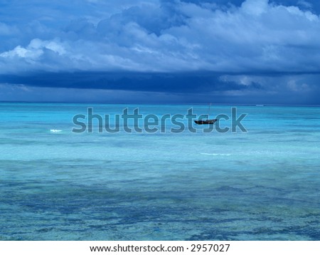 Lonely sailboat in beautiful Indian Ocean. Island Zanzibar.