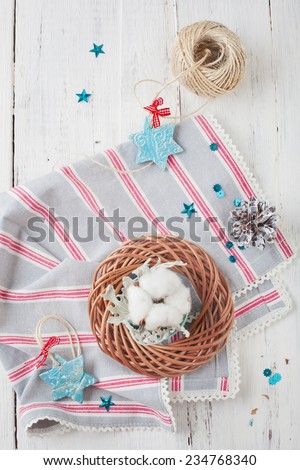Christmas decorations - stars and wreath with cotton on white wooden table