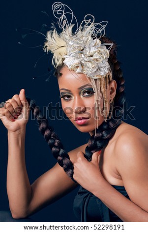 Young fashion model with beautiful makeup and a creative hair accessories