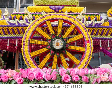 Wheel of a cart is made from flowers (Chiang Mai Flower Festival, Thailand)