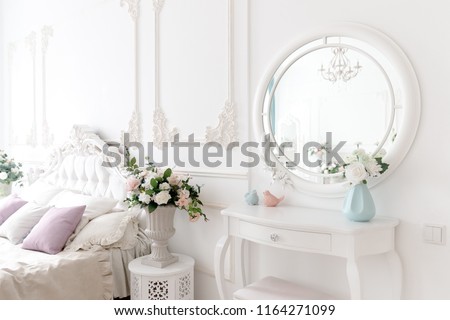 Boudoir table. Details of interior bedroom for girls and make-up, hairstyles with mirror