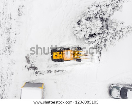 Drone top view snow removal excavator truck