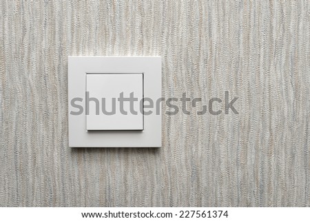 Light switch / White light switch on grey wall / Concept / On Off